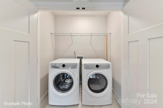 clothes washing area featuring separate washer and dryer, washer hookup, and tile flooring