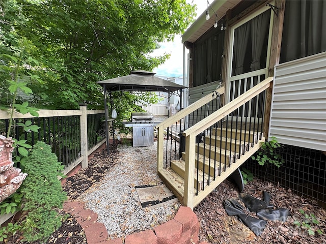 view of terrace featuring a grill and a gazebo