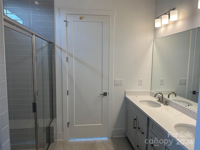 bathroom with vanity and walk in shower