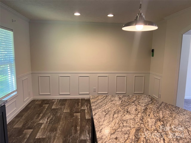 empty room featuring ornamental molding and dark hardwood / wood-style floors