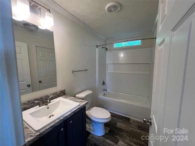 full bathroom with wood-type flooring, oversized vanity, shower / bath combination, toilet, and a textured ceiling