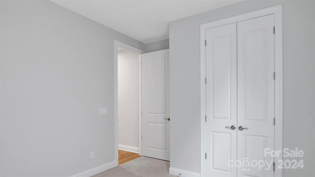 unfurnished bedroom with a closet