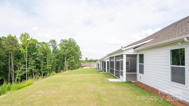 view of yard featuring a sunroom