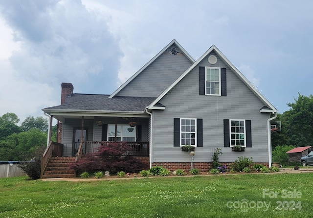 view of front property with a porch and a front yard