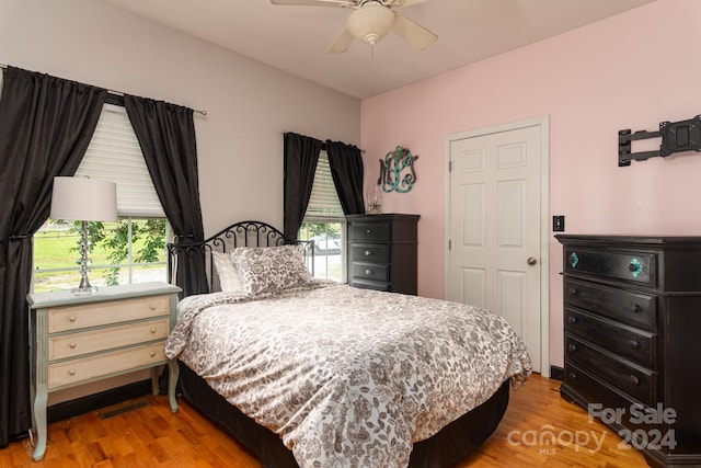 bedroom featuring light hardwood / wood-style flooring and ceiling fan