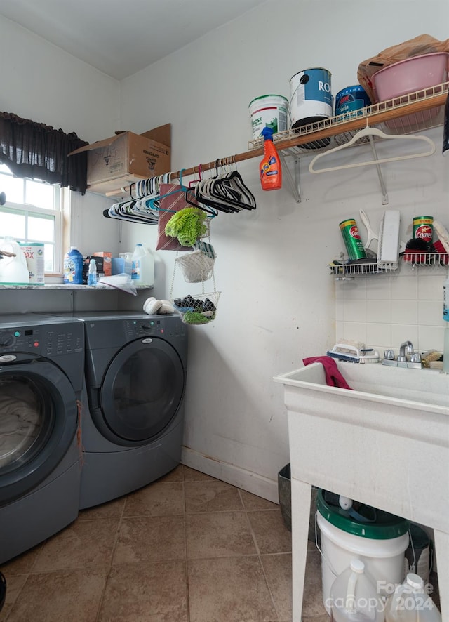 laundry area with separate washer and dryer and tile floors