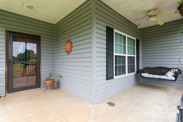 entrance to property featuring ceiling fan