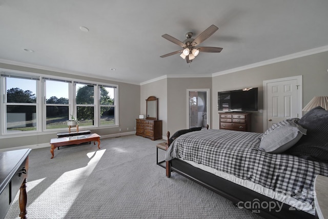 bedroom with light colored carpet, ceiling fan, and crown molding