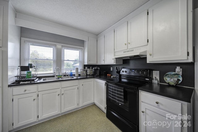 kitchen with backsplash, white cabinets, a textured ceiling, black electric range, and sink