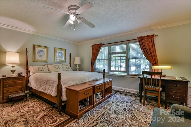 bedroom with ornamental molding, ceiling fan, and a textured ceiling