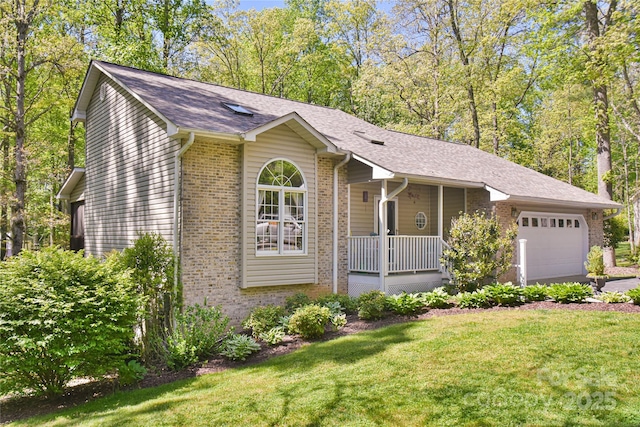 145 Fox Glen Dr, Arden, NC 28704 - ranch-style house with covered porch, an attached garage, brick siding, a front lawn, and roof with shingles