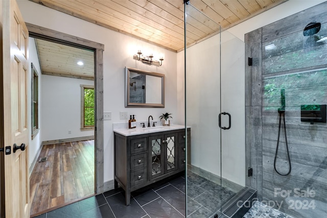 bathroom with vanity, an enclosed shower, and wooden ceiling