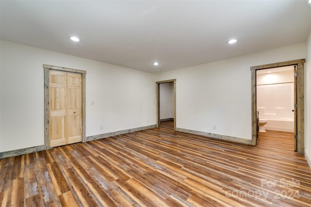 spare room featuring hardwood / wood-style floors