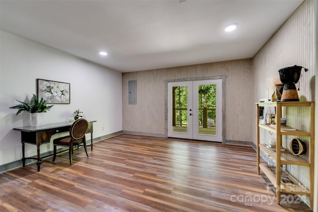 home office with electric panel, french doors, and wood-type flooring