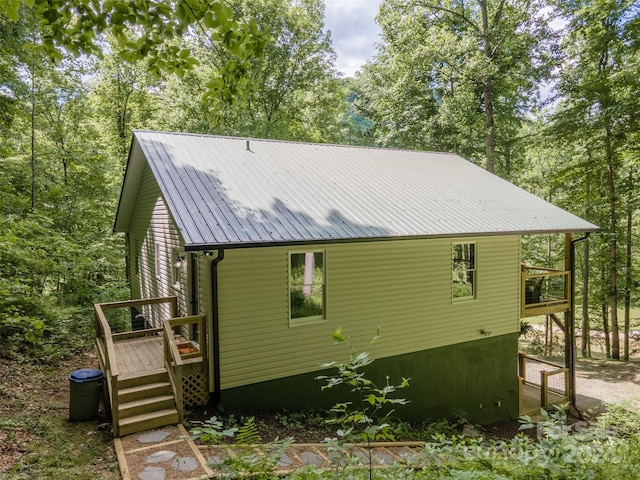 view of side of home with a deck