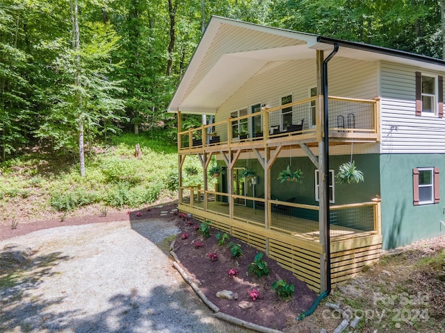 view of home's exterior featuring a balcony