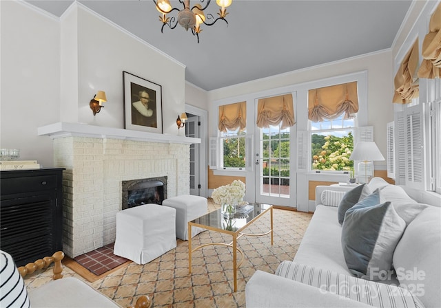 living room with a chandelier, a fireplace, and ornamental molding