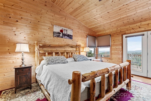 bedroom featuring wooden ceiling, lofted ceiling, and access to exterior