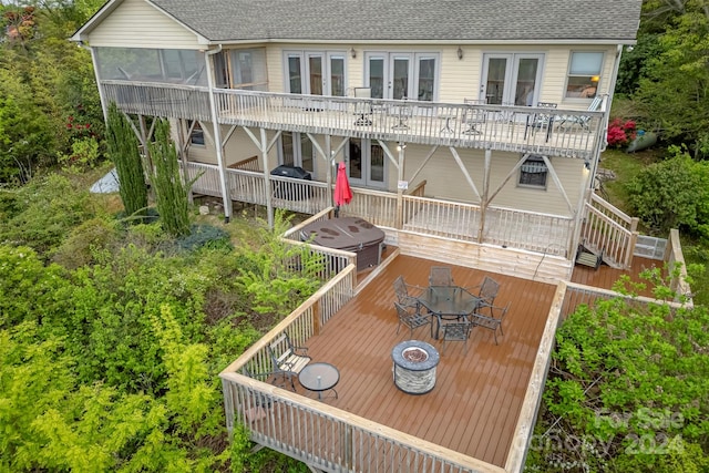 rear view of house with a deck