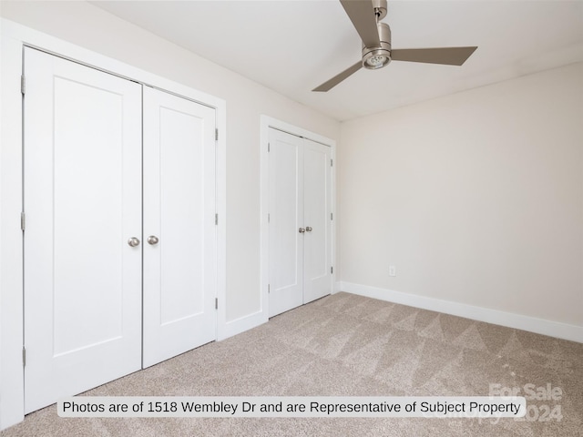 unfurnished bedroom with light colored carpet and ceiling fan