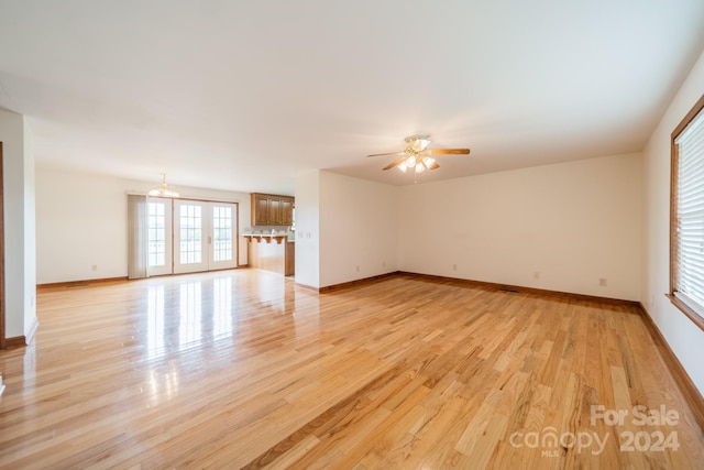 interior space with ceiling fan and light wood-type flooring