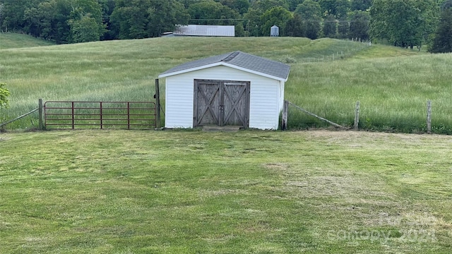 view of shed / structure featuring a yard