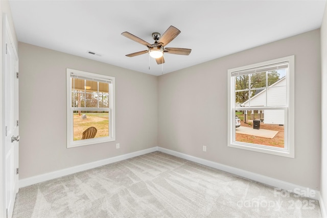 carpeted empty room with ceiling fan