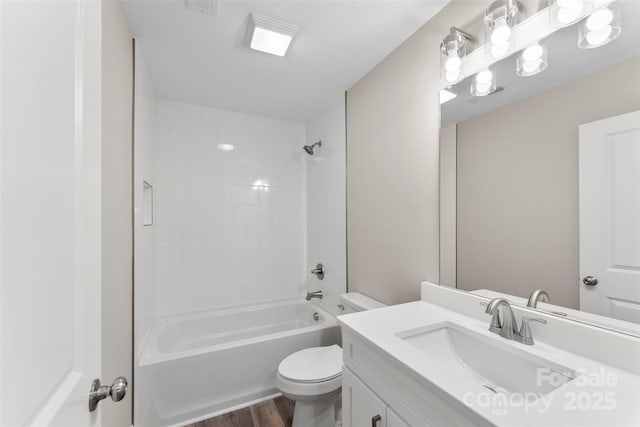 full bathroom with shower / bathing tub combination, vanity, hardwood / wood-style flooring, and toilet