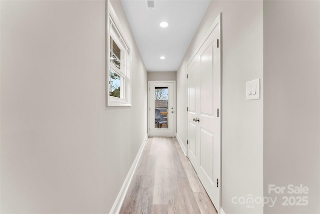 corridor featuring light wood-type flooring