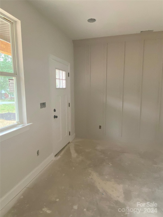 entryway with concrete flooring and a wealth of natural light