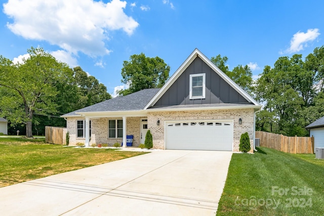 view of front facade with a garage and a front lawn