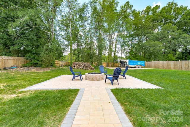 view of yard with a patio area and a fire pit