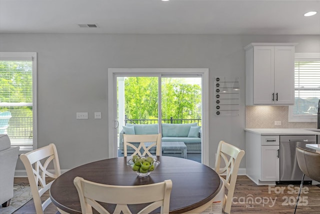 dining space featuring hardwood / wood-style floors