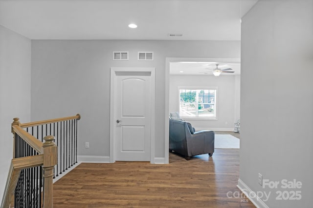 corridor featuring hardwood / wood-style floors