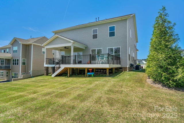 back of property featuring ceiling fan, a deck, a lawn, and central AC