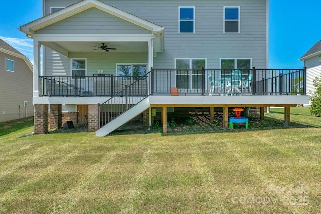 back of house with ceiling fan, a lawn, and a wooden deck