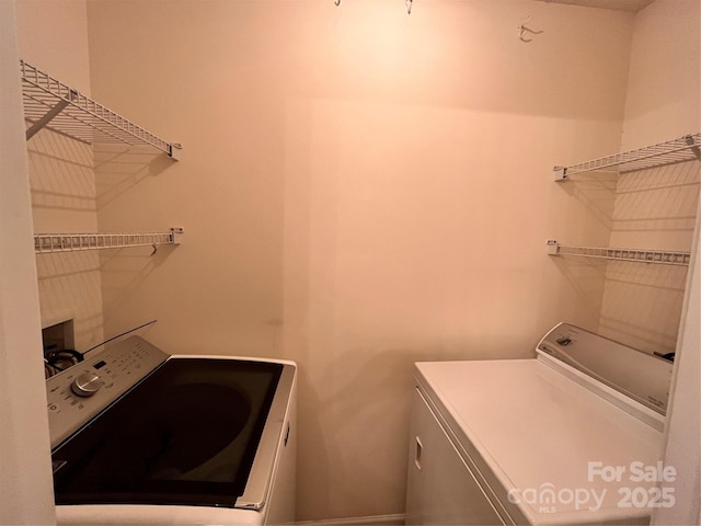 laundry area featuring washing machine and dryer