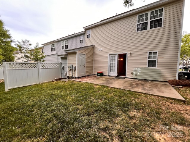 rear view of property featuring a patio