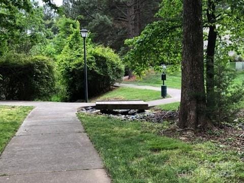 surrounding community with a yard