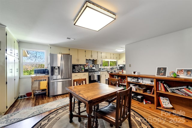 dining room with wood-type flooring