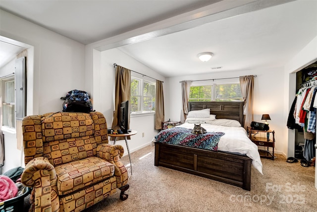 bedroom featuring light carpet