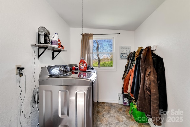 laundry area with independent washer and dryer