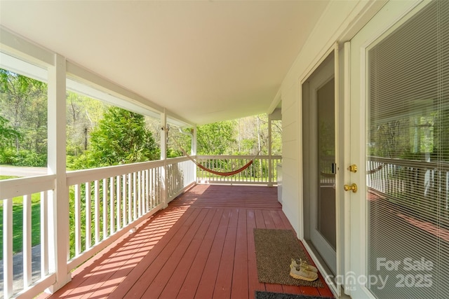 wooden terrace with a porch