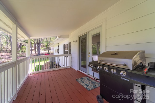 wooden deck featuring grilling area