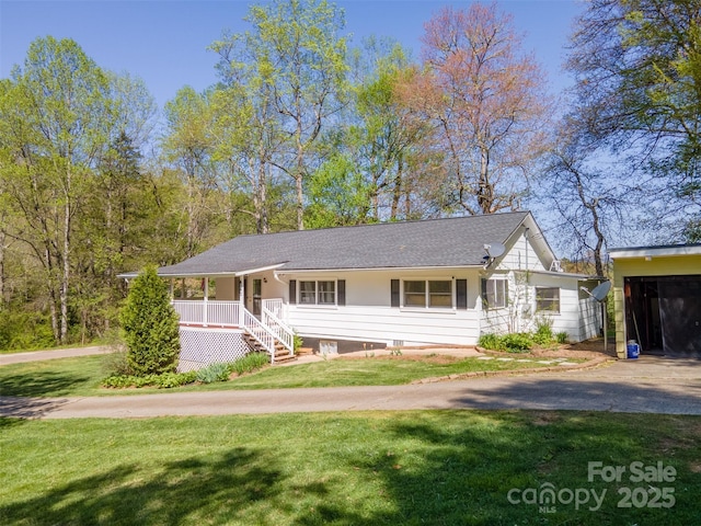 single story home with covered porch and a front lawn