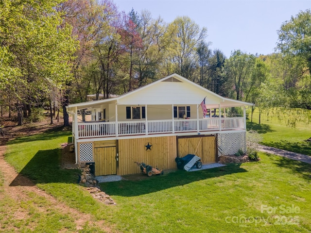 exterior space featuring a porch and a lawn