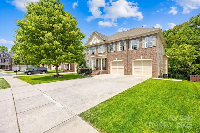 view of front of home with a front yard and a garage