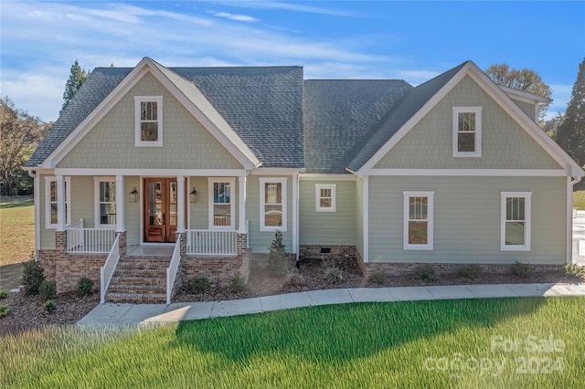 craftsman-style home with a porch and a front yard