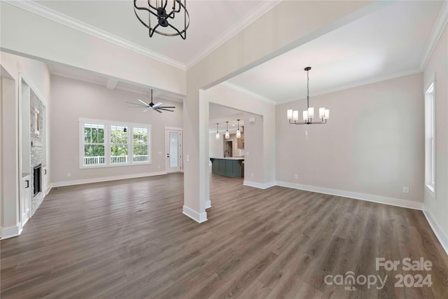 unfurnished living room with ceiling fan with notable chandelier, crown molding, dark wood-type flooring, and sink