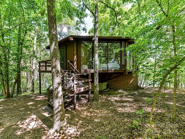 back of house with a sunroom